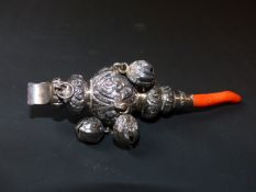 A Victorian babies silver rattle with coral teething piece. Marks for Birmingham, date letter