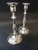 A pair of George III silver table candlesticks with turned columns and detachable sconces. Sheffield