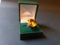 A gold set yellow synthetic sapphire dress ring