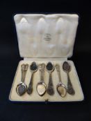 An oak cased set of twelve silver tea knives and forks with mother of pearl handles. London 1886.