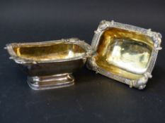 A pair of George III silver table salts with gilded interiors, ribbed borders with scallop motifs,