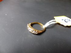 A graduated five stone diamond ring set in precious metal.