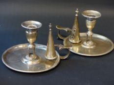 Two similar George III silver chambersticks with snuffers. Dated London 1787. Makers initials T.C.