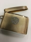 A 9ct gold engine turned vesta case with rose cut diamond monogram. P.S.M dated Birmingham 1923.