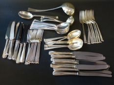 A Contemporary silver flatware service comprising eight dessert spoons, eight table soup spoons,