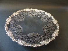 A silver tazza with cut carved vine border embossed rim on pedestal foot. Sheffield 1945. 27cm