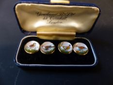 A pair of 18ct gold dress links designed with Essex crystal game birds