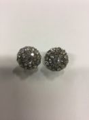 A pair of all diamond target cluster earrings set with old cut diamonds. 1.5cm diameter.