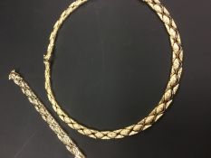 A contemporary 9ct gold coloured necklace and matching bracelet. 42grams