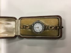 A lady's 18k gold coloured bracelet watch, the bezel set with old cut diamonds