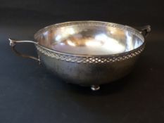 A silver two handled rose bowl with pierced border hammered finish. Dated Birmingham 1925. Makers A.