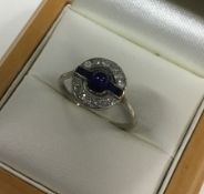 An Art Deco sapphire and diamond cluster cocktail ring
