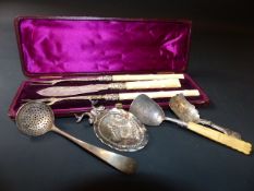 A Victorian cased set of two silver pickle forks and a butter knife with ivory handles, Birmingham