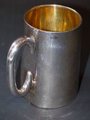 A late Victorian silver cylindrical tankard, with glass base. London 1883. Weight all in at 10ozs