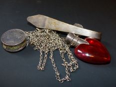 An early Continental silver coloured metal chatelaine with pin cushion together with a ruby glass