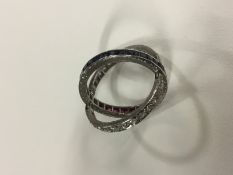 A circa 1930's diamond, sapphire and ruby set cocktail ring.