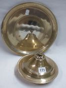 A MIDDLE EASTERN SILVER COLOURED MUFFIN DISH AND COVER. 21CM DIAMETER TOGETHER WITH A SIMILAR