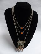 TWO TRIBAL STYLIZED WHITE METAL AND HARDSTONE NECKLACES