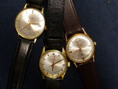 THREE GENTS GOLD PLATED WRIST WATCHES BY EVENITE, DEMAN AND SELZA (3)