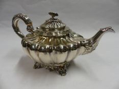 A VICTORIAN SILVER TEAPOT WITH EMBOSSED DECORATIONS. LONDON 1839. 22 OZS ALL IN