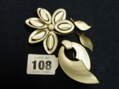 TWO NORWEGIAN SILVER AND WHITE ENAMEL FLOWER BROOCHES AND A PAIR OF MATCHING EARCLIPS (4)