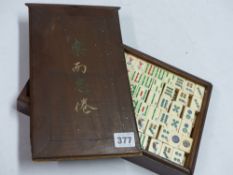 A CASED SET OF MAHJONG TILES