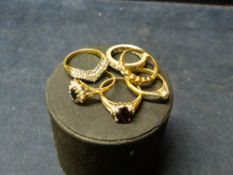 SIX VARIOUS GOLD AND OTHER STONE SET RINGS