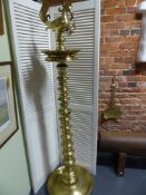 A LARGE BRASS PERSIAN STANDING OIL LAMP