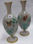 A PAIR OF GLASS VASES WITH BIRD DECORATION