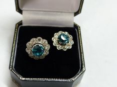 A PAIR OF BLUE ZIRCON AND DIAMOND CLUSTER EARRINGS