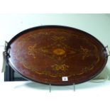 AN OVAL INLAID MAHOGANY TRAY WITH BRASS HANDLES