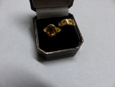 A GOLD COLOURED THREE STONE DIAMOND SET RING TOGETHER WITH A CITRINE SET DRESS RING (2)