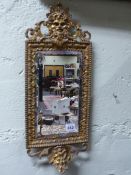 AN ANTIQUE BAROQUE STYLE ORMOLU PIER MIRROR