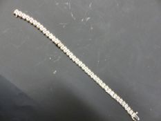 A 9CT GOLD DIAMOND SET TENNIS BRACELET