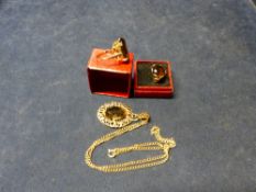 TWO GOLD CITRINE SET DRESS RINGS AND A CITRINE SET PENDANT ON CHAIN