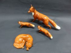 A QTY OF BESWICK FOXES