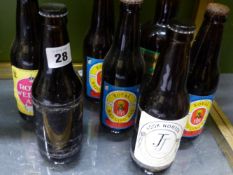 SEVEN COMMEMORATIVE BOTTLES OF ALE (ONE EMPTY)