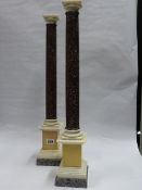 A PAIR OF PORPHYRY AND MARBLE COLUMNS AFTER THE ANTIQUE