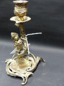 A SILVERED BRONZE CANDLESTICK IN THE ROCOCO TASTE