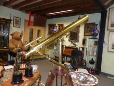 A GOOD BRASS TELESCOPE ON MAHOGANY STAND