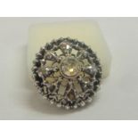 Yellow Metal & Silver Set Circular Brooch set old cut diamond, large central stone with 8 spoked