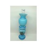 A DECORATIVE FRENCH GLASS OIL LAMP OF DOUBLE GOURD FORM, DECORATED THROUGHOUT IN PALE BLUE AND