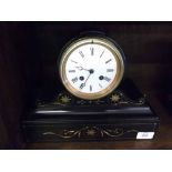 LATE 19TH CENTURY FRENCH BLACK SLATE DRUM HEAD 8-DAY MANTEL CLOCK, THE WHITE ENAMEL DIAL WITH