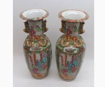 A PAIR OF 19TH CENTURY CHINESE CANTON VASES, TYPICALLY DECORATED WITH PANELS, VARIOUS FIGURES,
