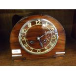 20TH CENTURY MANTEL CLOCK IN THE ART DECO STYLE, THE ARCHED STAINED WOODEN CASE WITH ROMAN CHAPTER