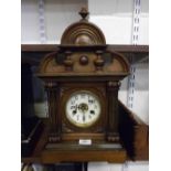 LATE 19TH OR EARLY 20TH CENTURY ENGLISH MANTEL CLOCK, WITH STAINED WOODEN CASE, HINGED FRONT DOOR