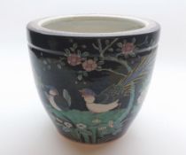 A CHINESE FAMILLE NOIR JARDINITRE OF CIRCULAR FORM DECORATED WITH BIRDS AMONGST FOLIAGE, 9" HIGH