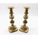 PAIR OF 19TH CENTURY BRASS CANDLESTICKS OF KNOPPED FORM, RAISED ON OCTAGONAL BASES, 10" HIGH