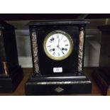 FRENCH BLACK SLATE AND MARBLE MANTEL CLOCK OF ARCHITECTURAL FORM, THE CASE WITH TWO SIDE PILLARS,
