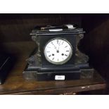 LATE 19TH CENTURY 8-DAY MANTEL CLOCK IN EBONISED WOODEN CASE OF ARCHITECTURAL FORM, WHITE ENAMEL